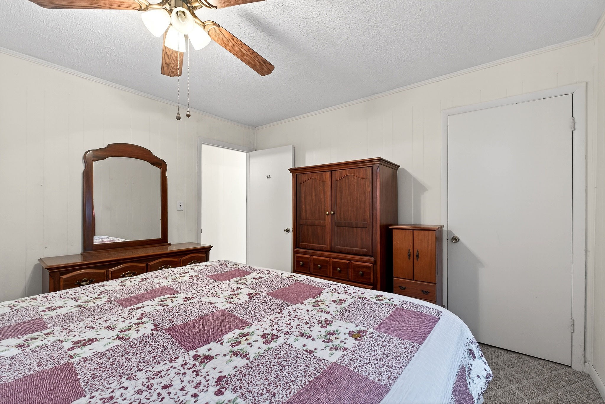 4463 Crisp Springs Road McMinnville, TN 37110 - Photo 16 of 26 a bedroom with a bed and a dresser