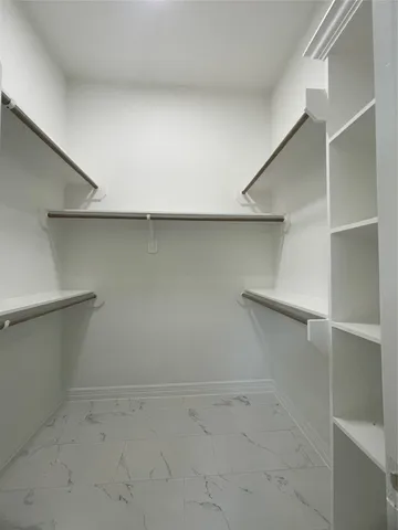 a view of an empty walk in closet