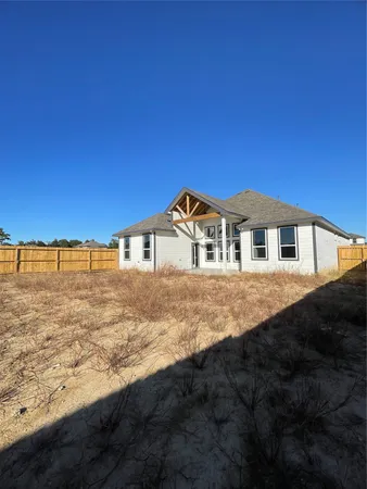 a view of house with yard