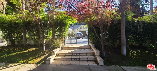 a view of house with yard