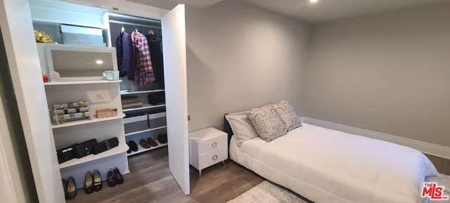 a bed room with a bed and a window