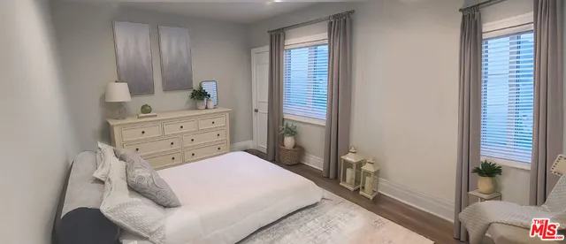 a bed room with a bed and a dresser
