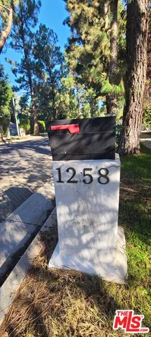 a view of outdoor space with wooden floor