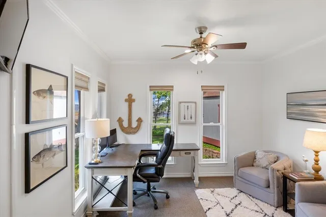 a view of a livingroom with furniture and a window
