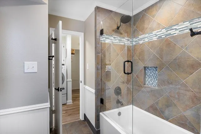 a bathroom with a shower and a tub