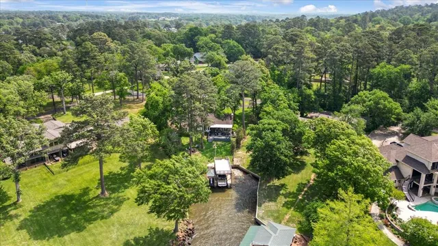 an aerial view of a house with yard