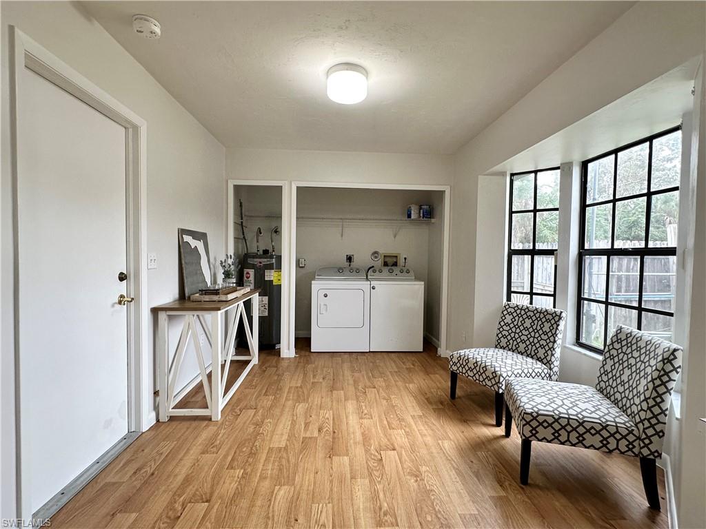 1961 Krape Road Naples, FL 34120 - Photo 29 of 44 a living room with furniture and a wooden floor