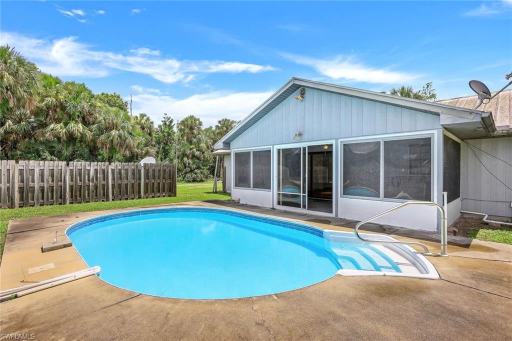 1961 Krape Road Naples, FL 34120 - Photo 5 of 44 a view of a house with pool and a yard