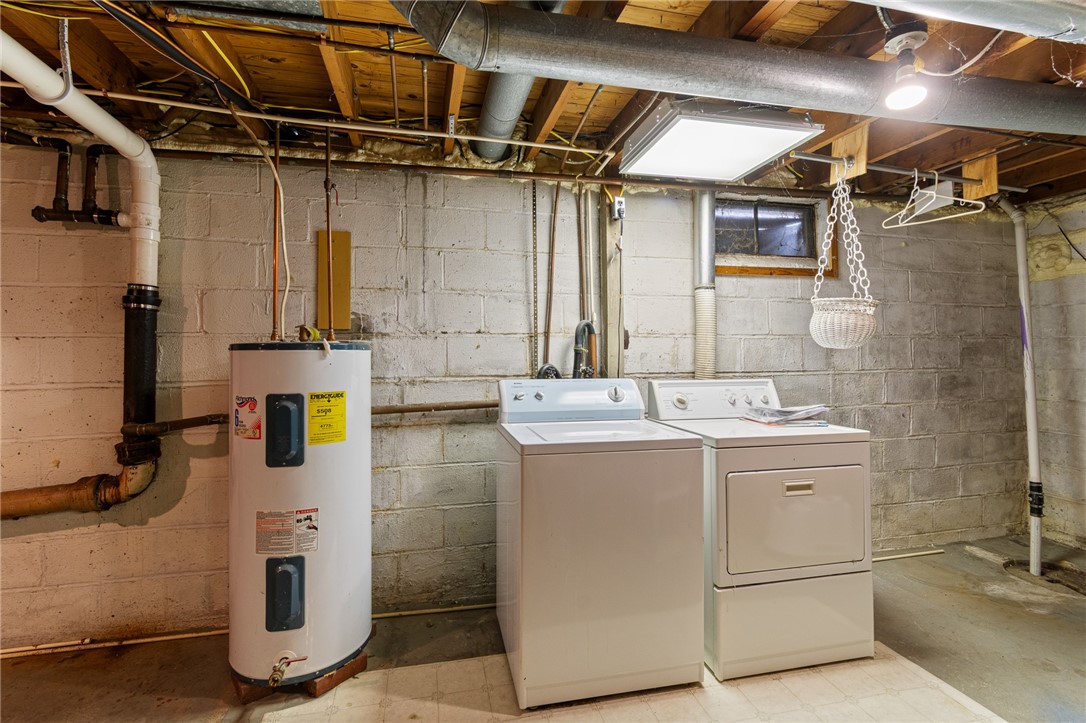 1404 Summit Drive Arcadia, NY 14513 - Photo 20 of 25 Laundry in Basement, Sump Pump & Water Heater