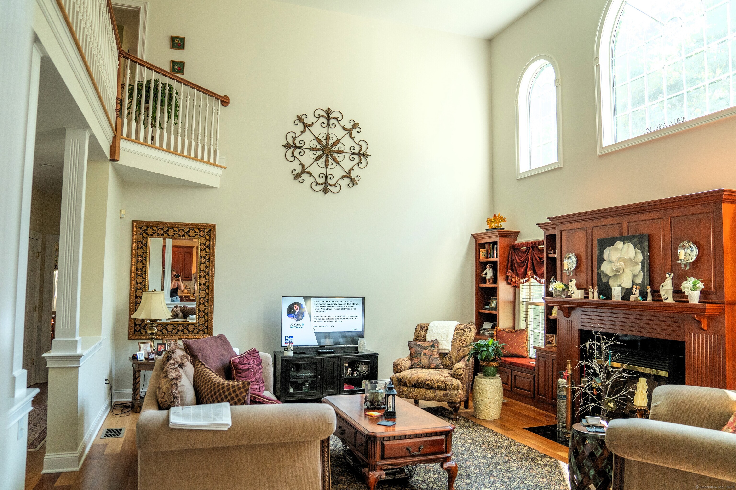 45 North Gate Road Woodbury, CT 06798 - Photo 14 of 40 a living room with furniture a fireplace and a window