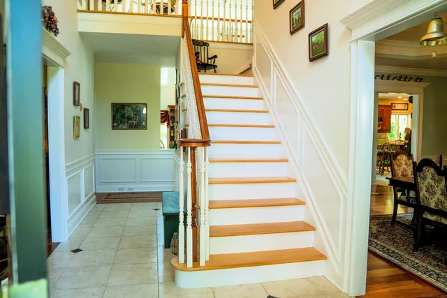 a view of a staircase and a living room