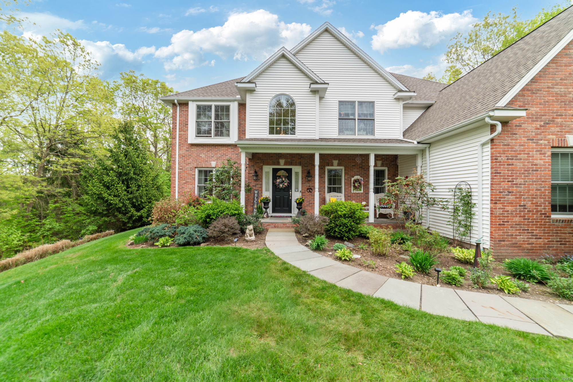 45 North Gate Road Woodbury, CT 06798 - Photo 2 of 40 a front view of a house with a yard and porch