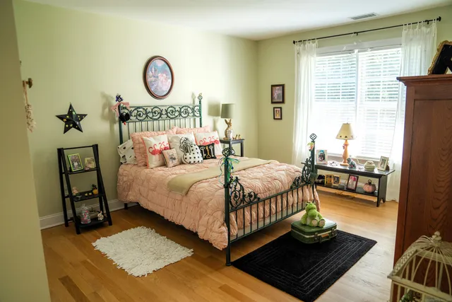 a bedroom with a bed and window