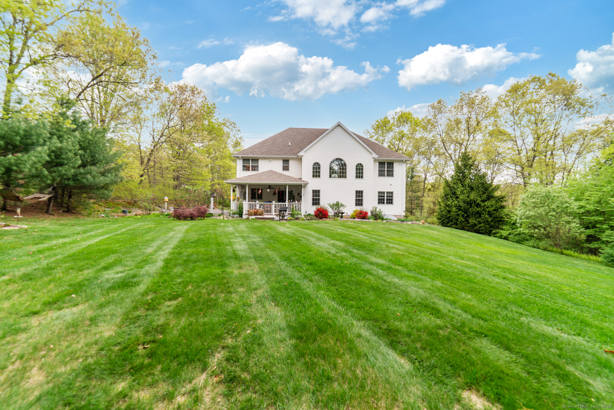 45 North Gate Road Woodbury, CT 06798 - Photo 29 of 40 a view of a house with a big yard and large trees