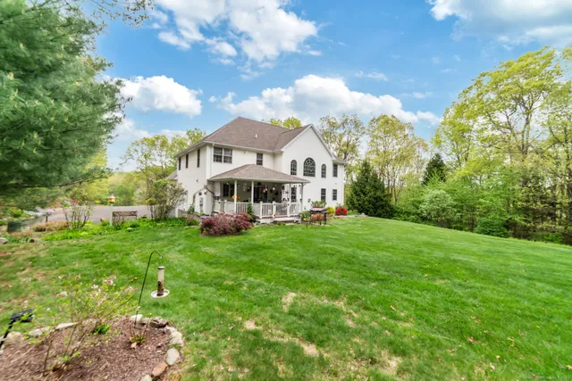 a view of a house with a big yard