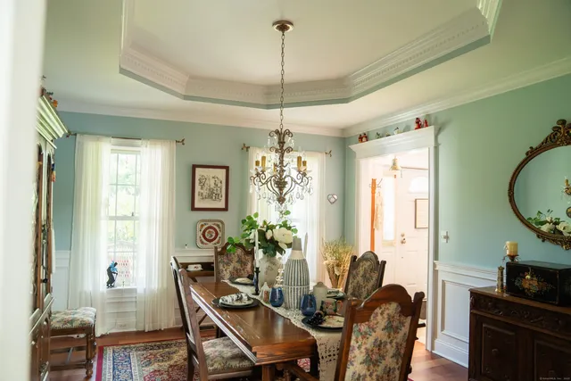 a view of a dining room with furniture window and wooden floor
