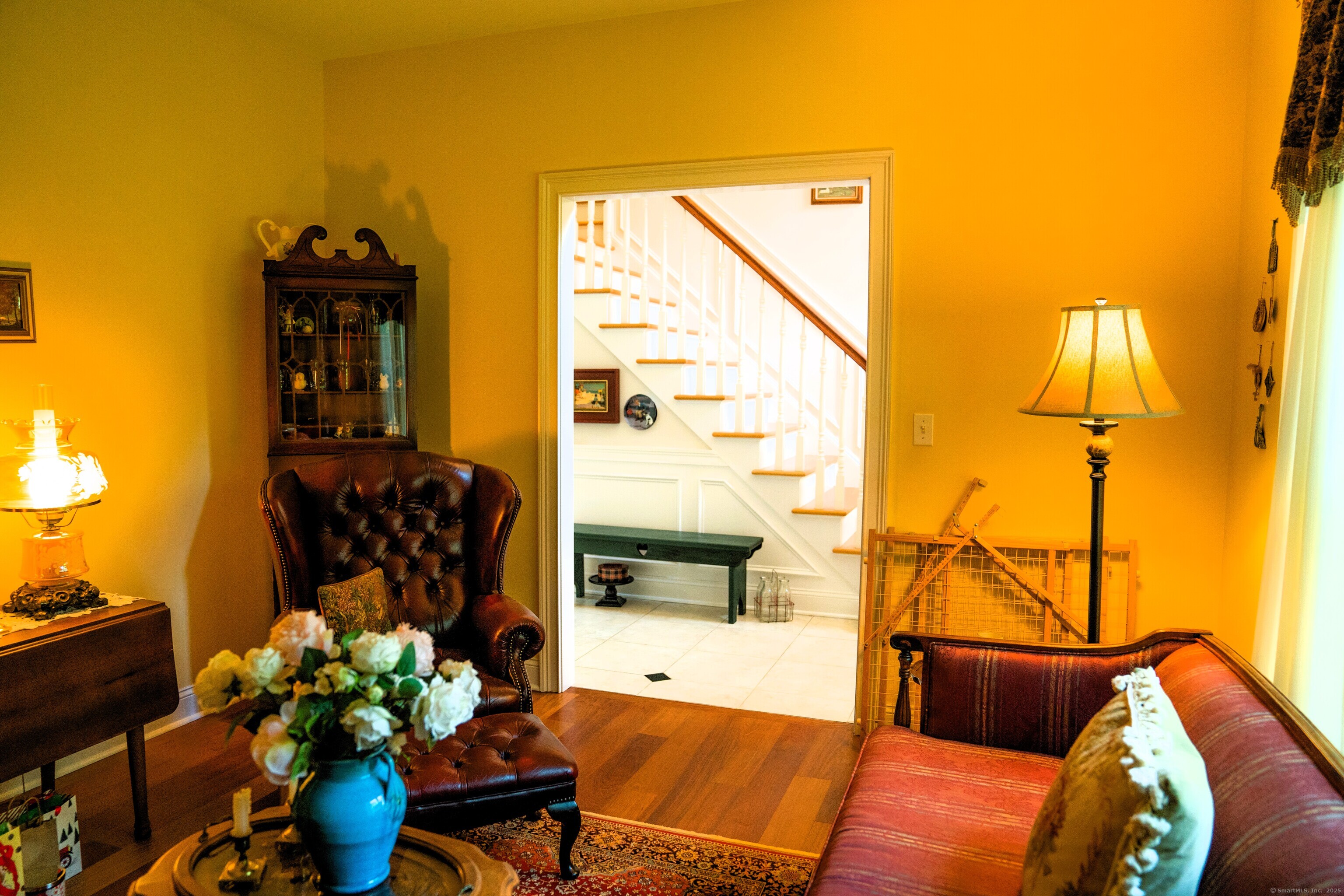 45 North Gate Road Woodbury, CT 06798 - Photo 6 of 40 a living room with furniture flowerpot and wooden floor