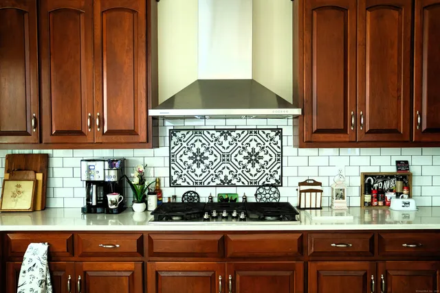 a kitchen with a stove and cabinets