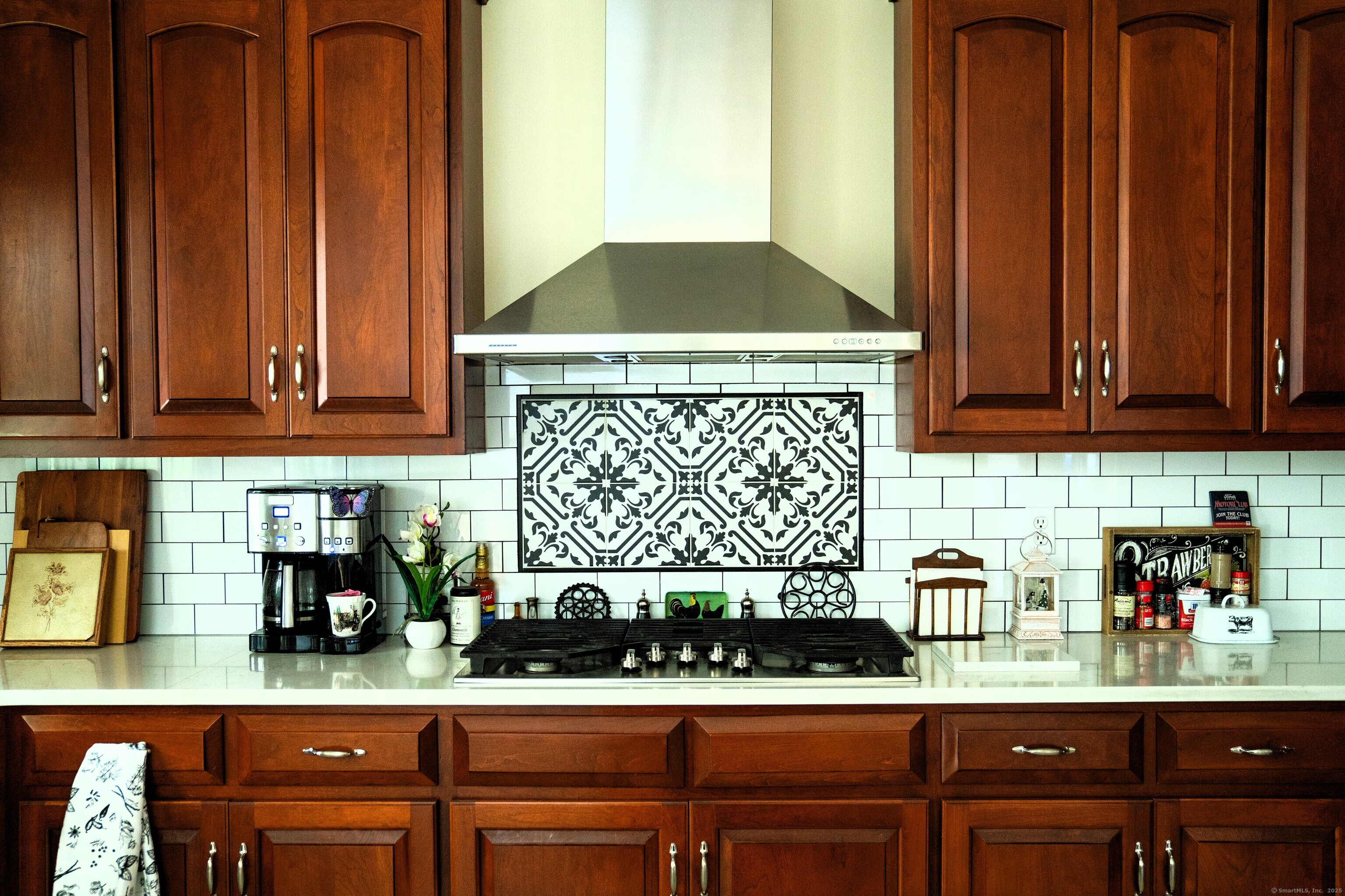 45 North Gate Road Woodbury, CT 06798 - Photo 10 of 40 a kitchen with a stove and cabinets