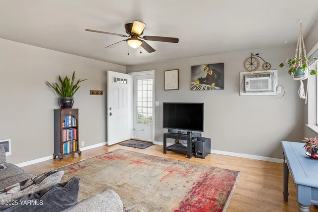 a bedroom with furniture and a flat screen tv