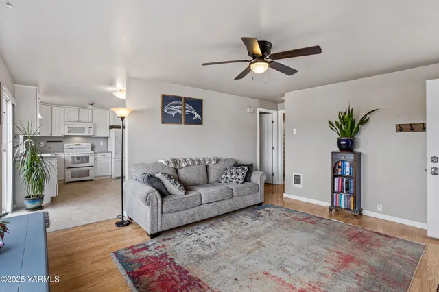 a living room with furniture and a table