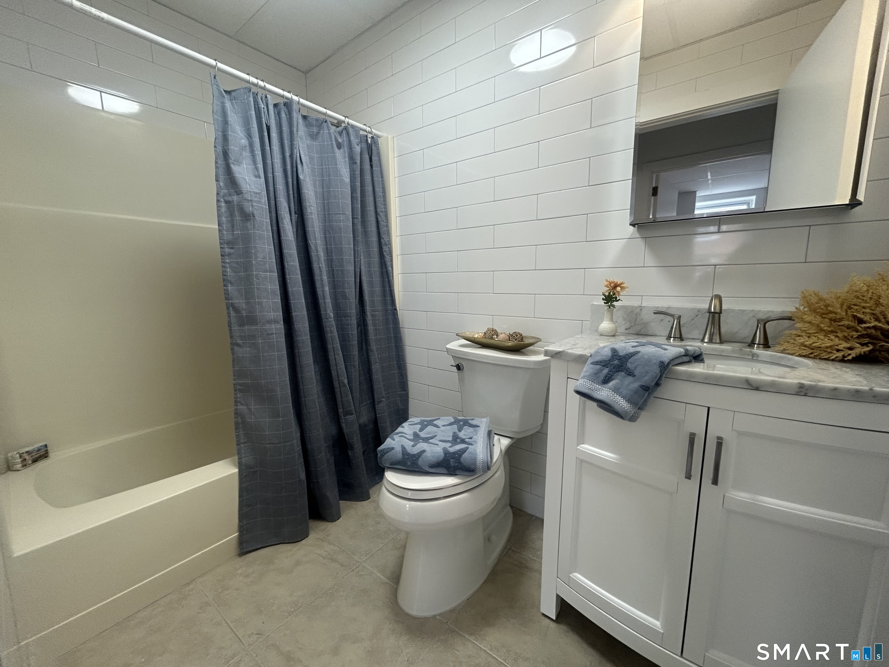 156 Garfield Avenue New London, CT 06320 - Photo 4 of 10 a bathroom with a granite countertop sink toilet and shower