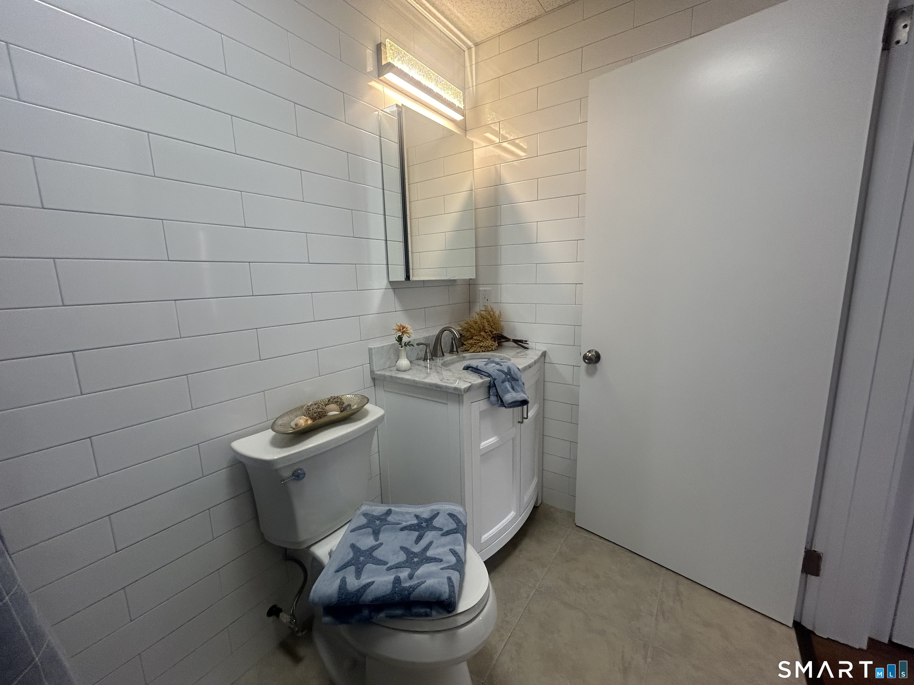 156 Garfield Avenue New London, CT 06320 - Photo 5 of 10 a bathroom with a sink toilet and shower