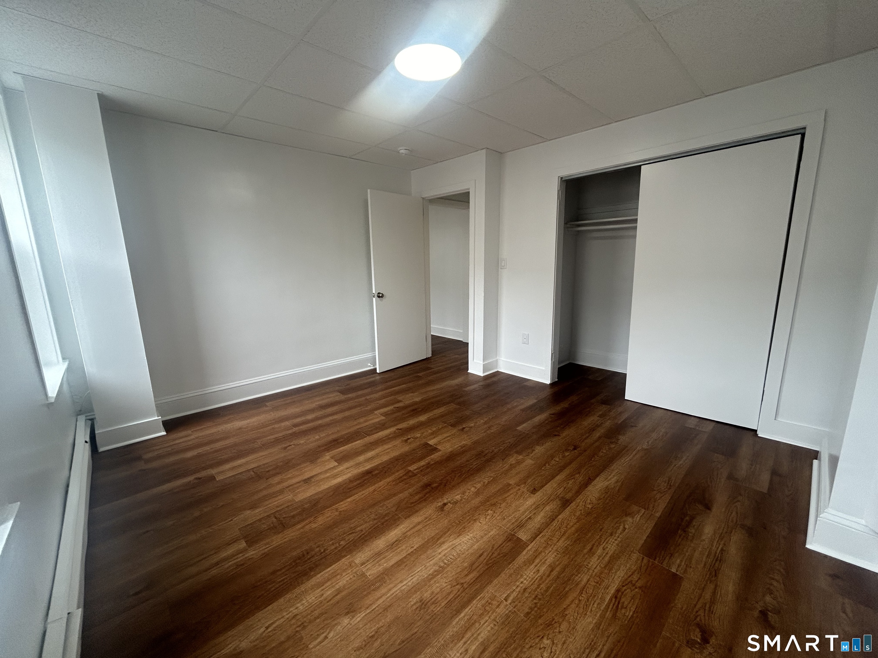 156 Garfield Avenue New London, CT 06320 - Photo 6 of 10 a view of empty room with wooden floor