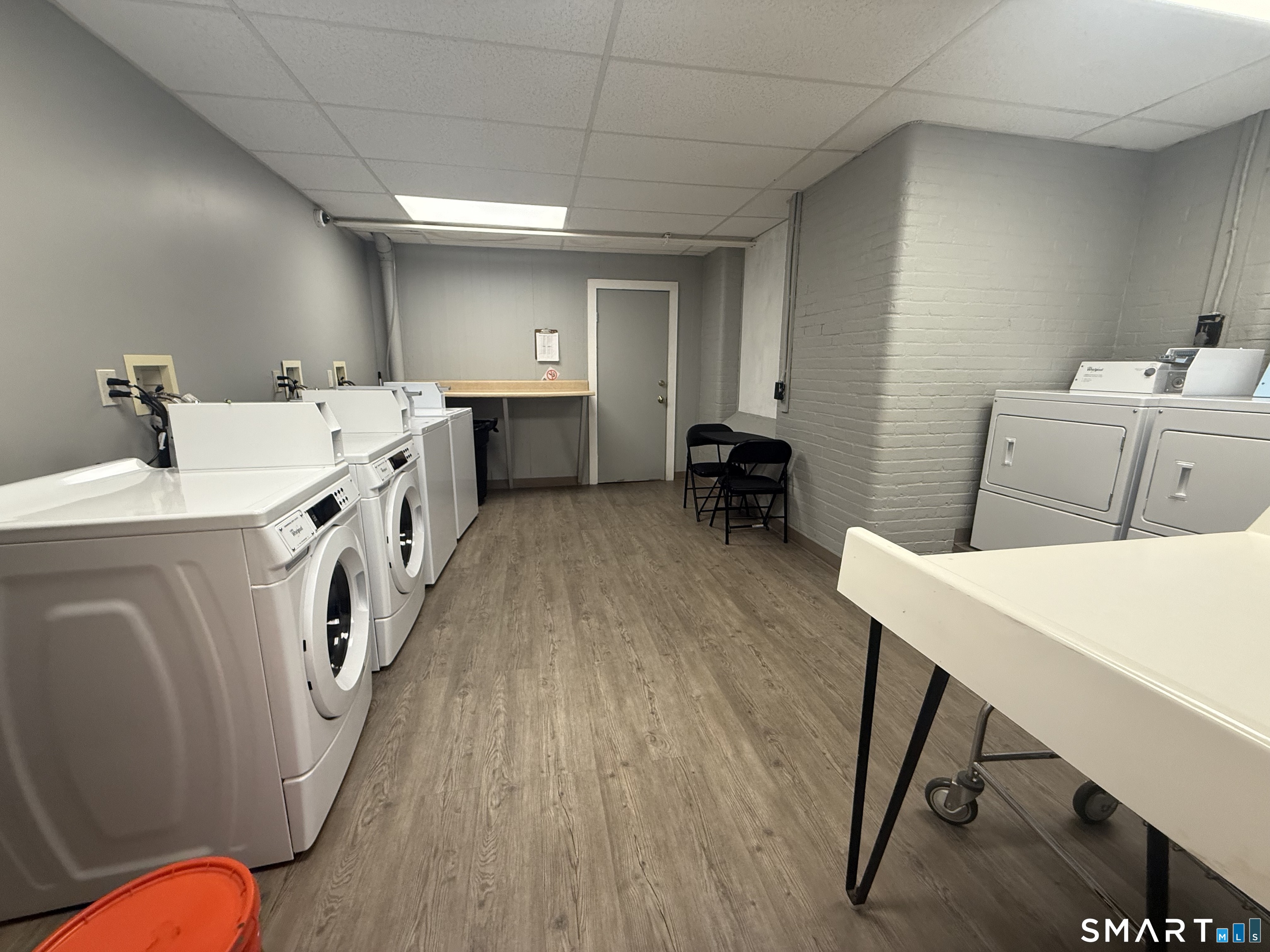 156 Garfield Avenue New London, CT 06320 - Photo 8 of 10 a utility room with cabinets washer and dryer