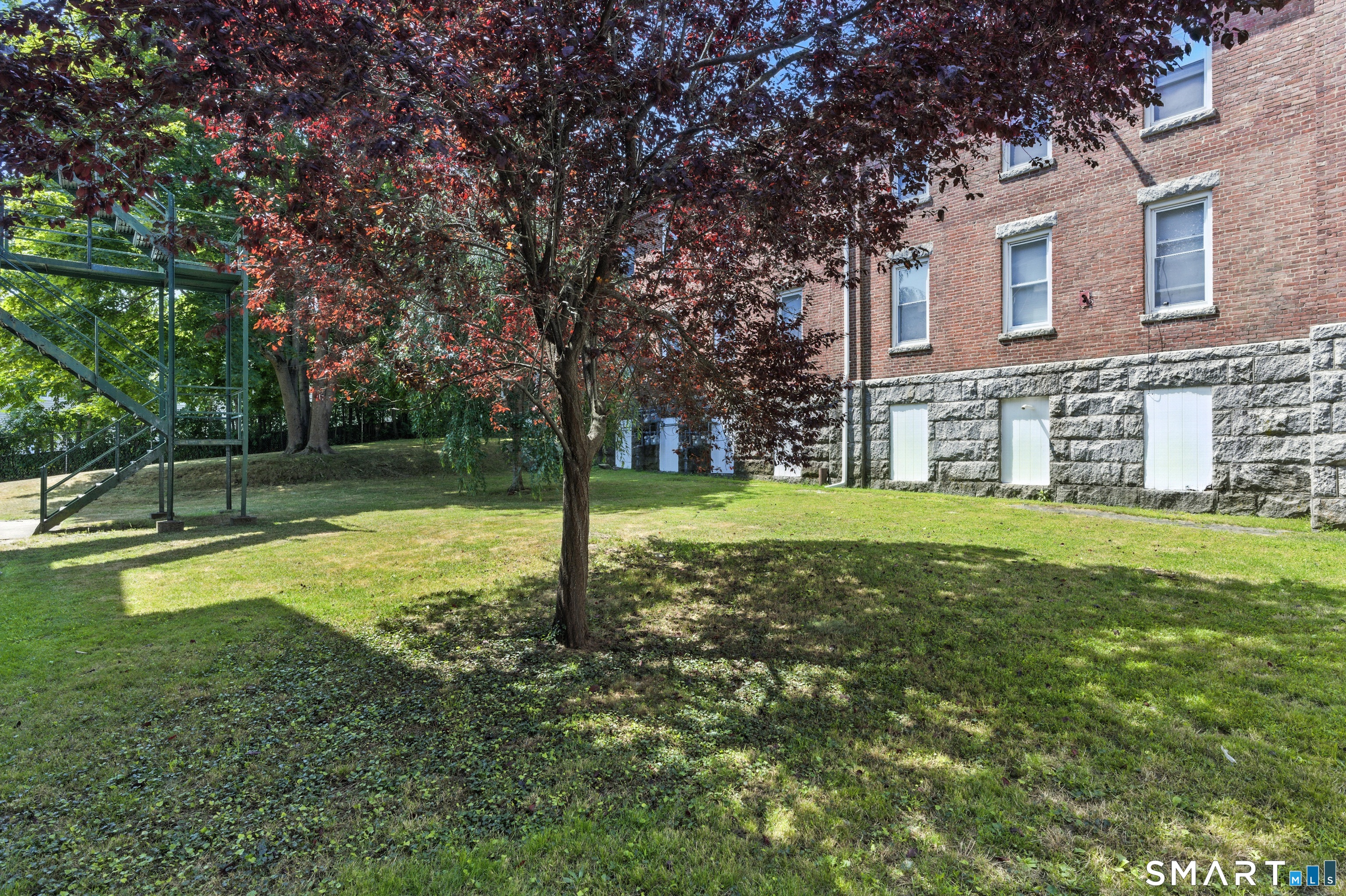 156 Garfield Avenue New London, CT 06320 - Photo 10 of 10 a view of a house with a backyard