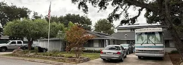 a car parked in front of a house