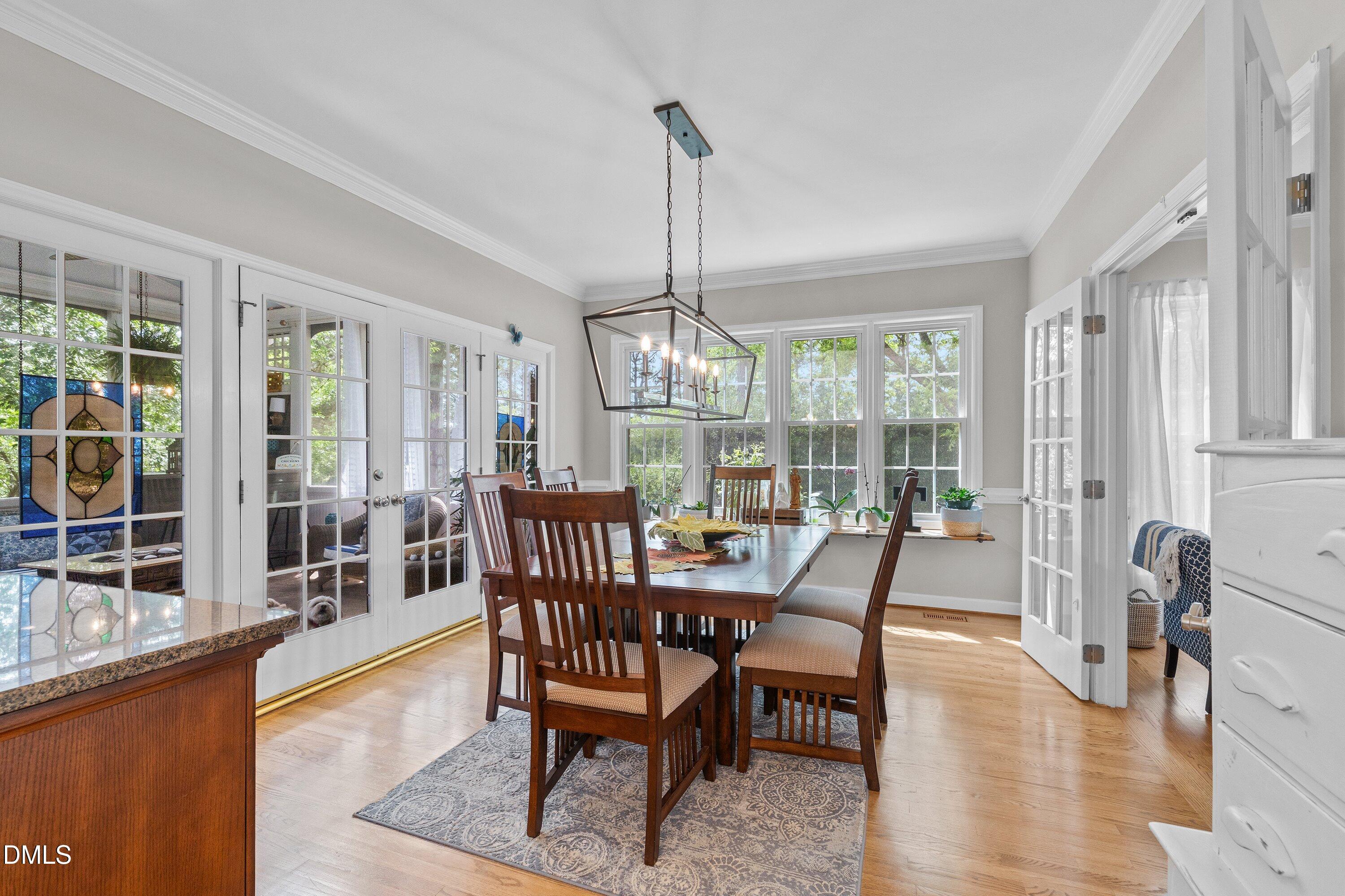 6612 Fowler Road Zebulon, NC 27597 - Photo 21 of 42 a dining room with furniture window wooden floor