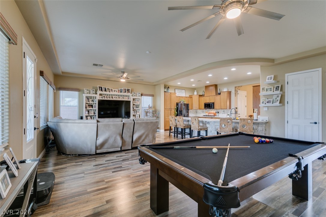 7524 Midnight Rambler Street Las Vegas, NV 89149 - Photo 49 of 51 An open floorplan seamlessly connects the inviting living area and a functional kitchen, perfect for daily living and entertaining.