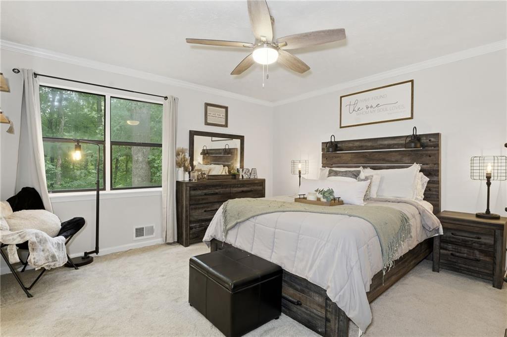 404 Brooks Street Dallas, GA 30157 - Photo 13 of 38 a spacious bedroom with a bed and a couch