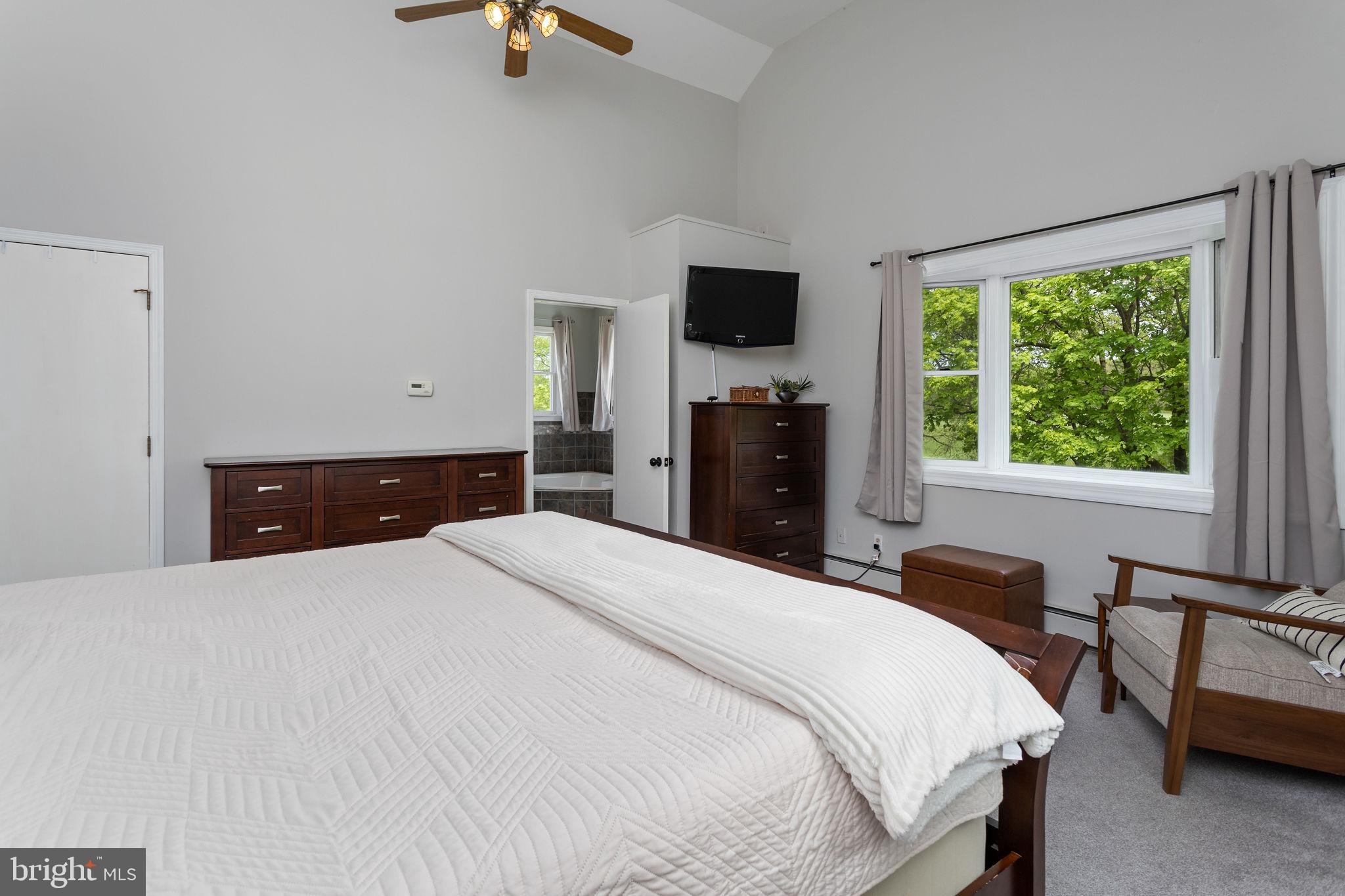 3950 Crosswicks Hamilton Square Road Hamilton, NJ 08691 - Photo 23 of 41 a bedroom with a bed and a flat tv screen on dresser