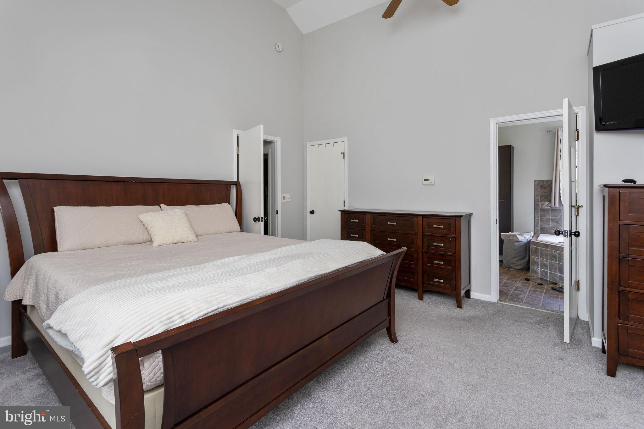3950 Crosswicks Hamilton Square Road Hamilton, NJ 08691 - Photo 24 of 41 a bedroom with a bed and a television