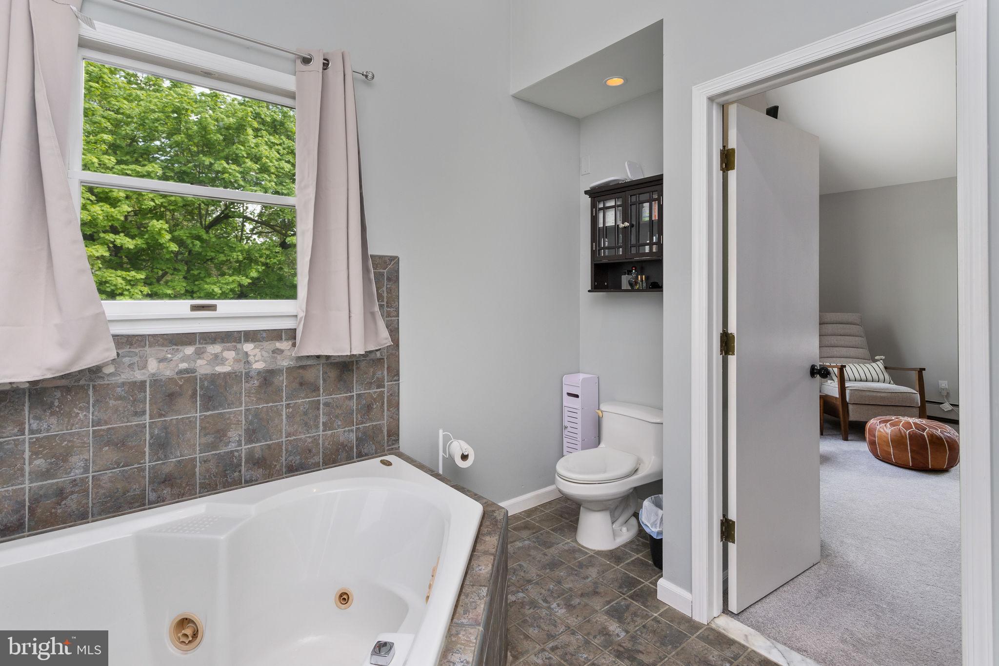 3950 Crosswicks Hamilton Square Road Hamilton, NJ 08691 - Photo 25 of 41 a bathroom with a tub a toilet and a shower