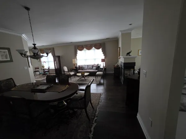 a dining room with furniture and a chandelier