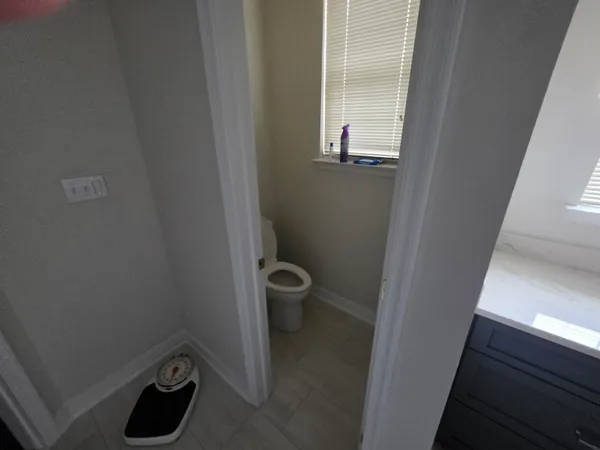 a bathroom with a toilet and sink
