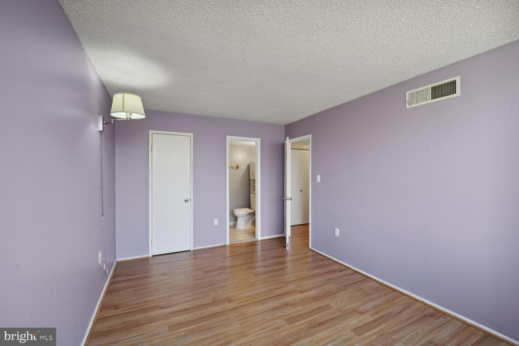 1830 Metzerott Road, Unit 205 Adelphi, MD 20783 - Photo 9 of 16 Master bedroom with half bath