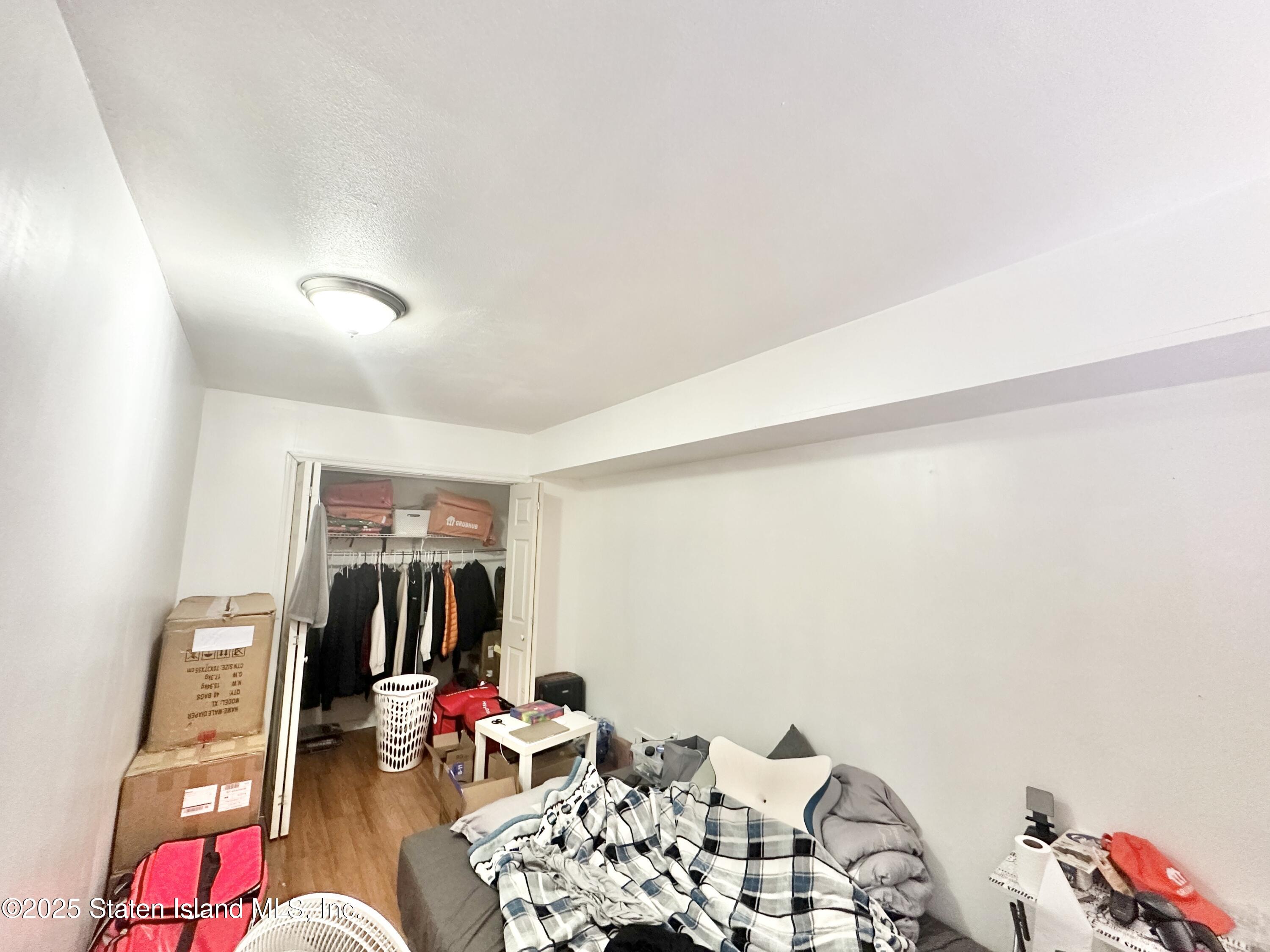 699 Elbe Avenue Staten Island, NY 10304 - Photo 4 of 8 a living room with furniture and white walls