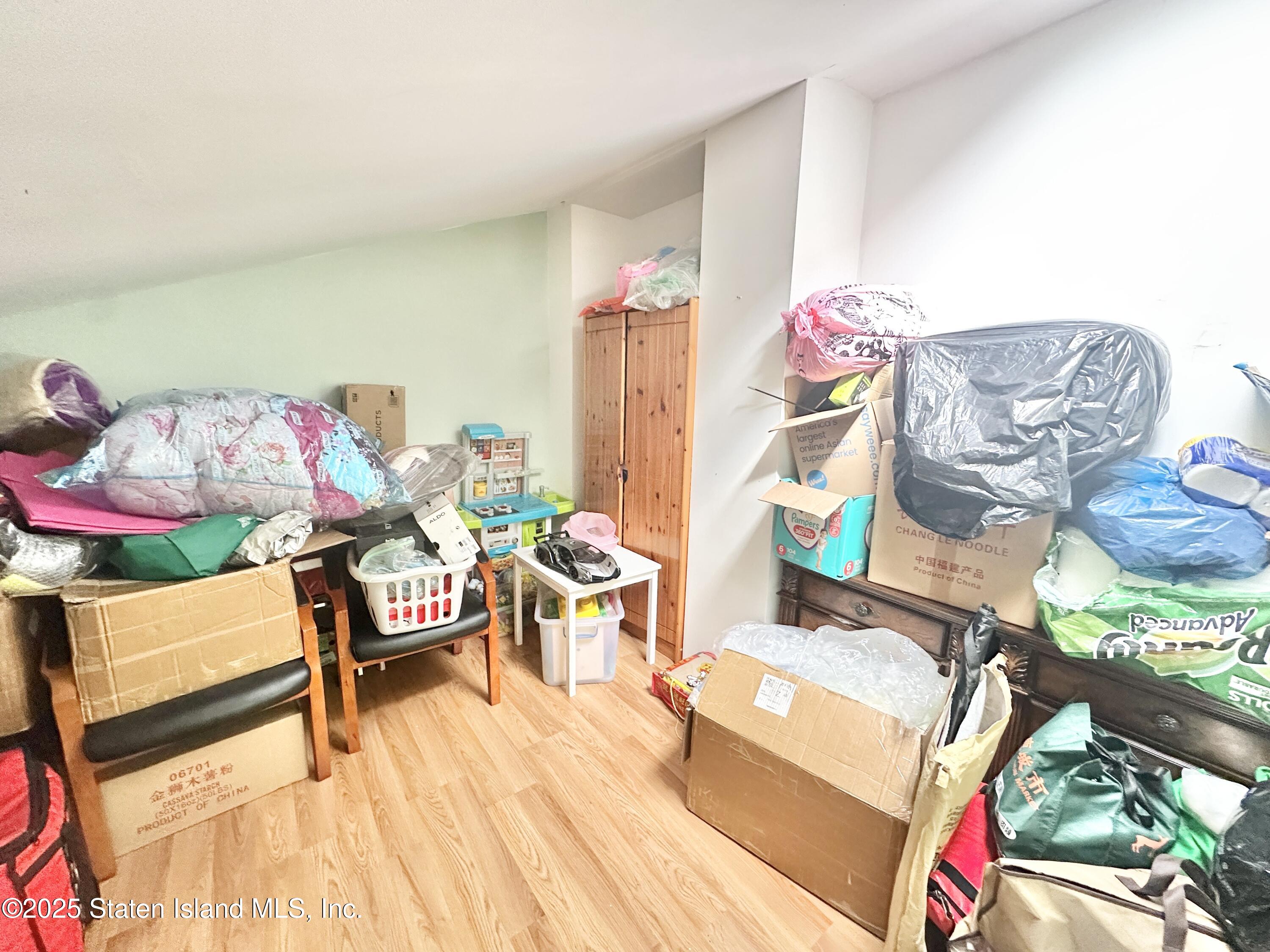 699 Elbe Avenue Staten Island, NY 10304 - Photo 5 of 8 a living room with furniture and toys