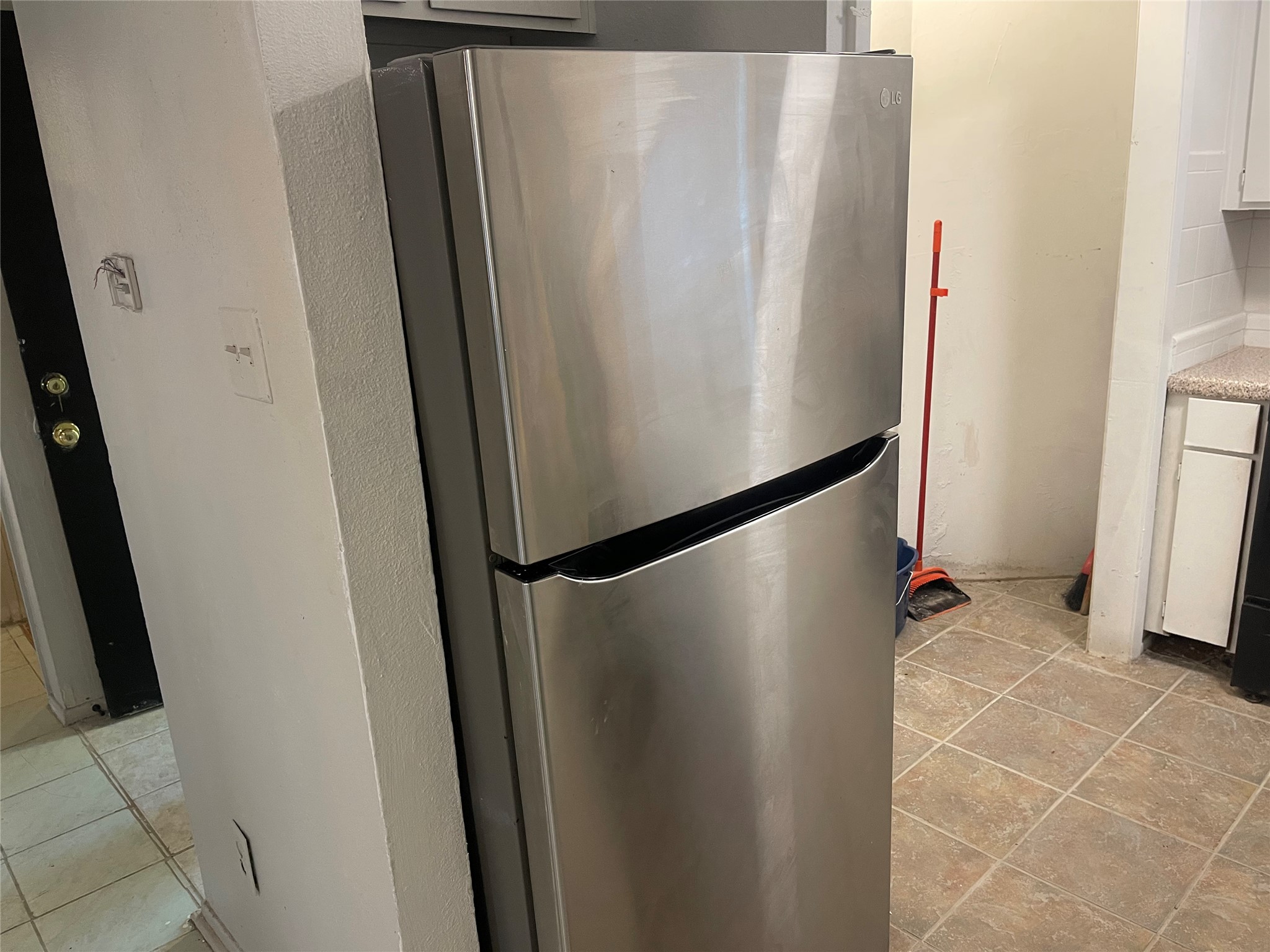 1902 West Loop, Unit A1 Austin, TX 78758 - Photo 13 of 22 a view of a refrigerator in kitchen