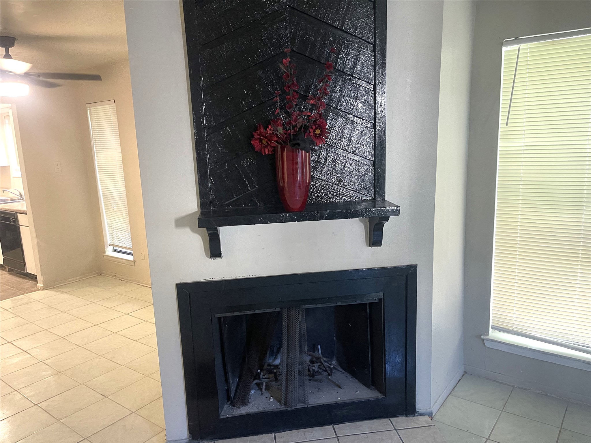 1902 West Loop, Unit A1 Austin, TX 78758 - Photo 4 of 22 a living room with a fireplace and a window