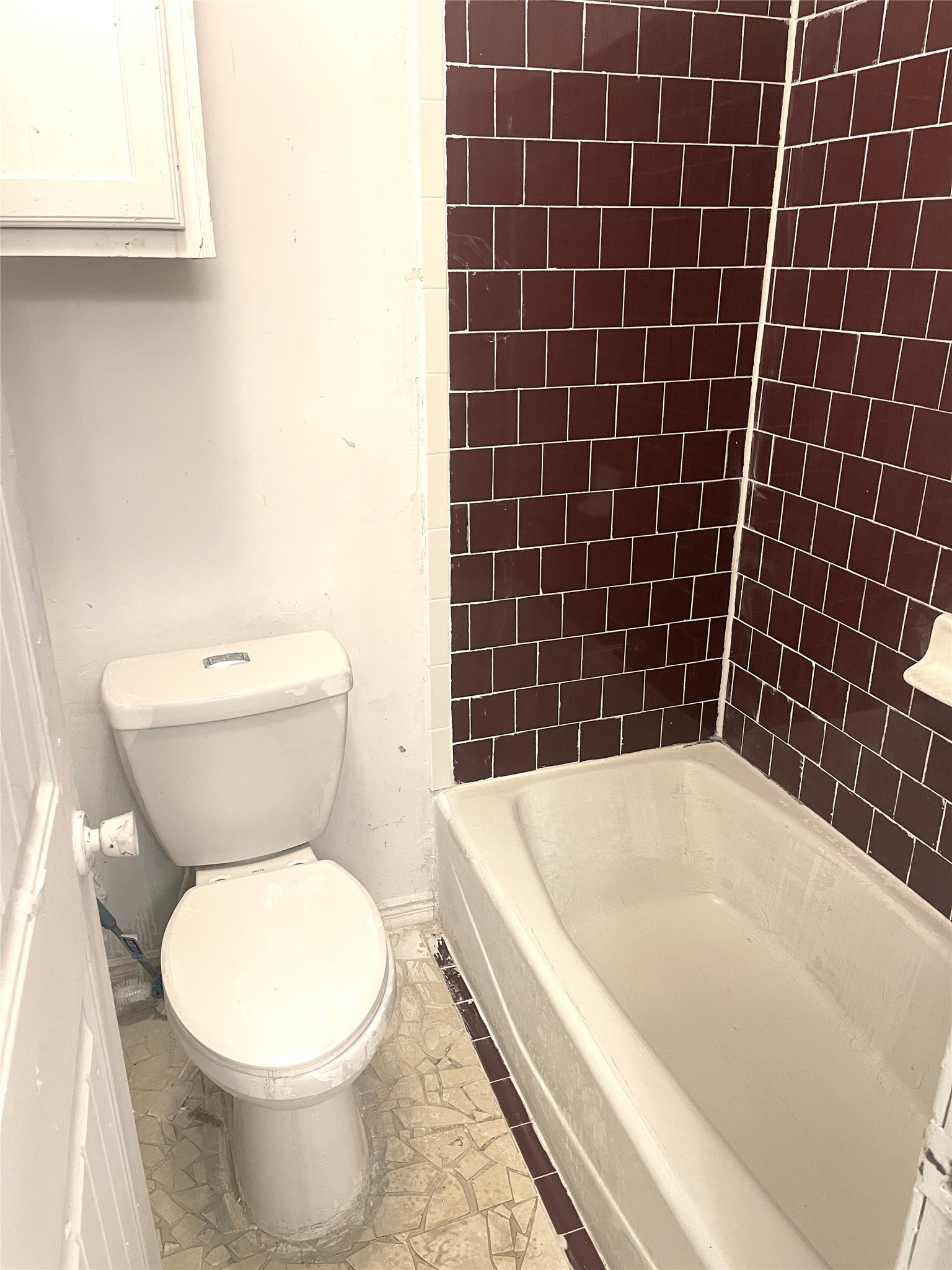1902 West Loop, Unit A1 Austin, TX 78758 - Photo 9 of 22 a white toilet sitting next to a bath tub