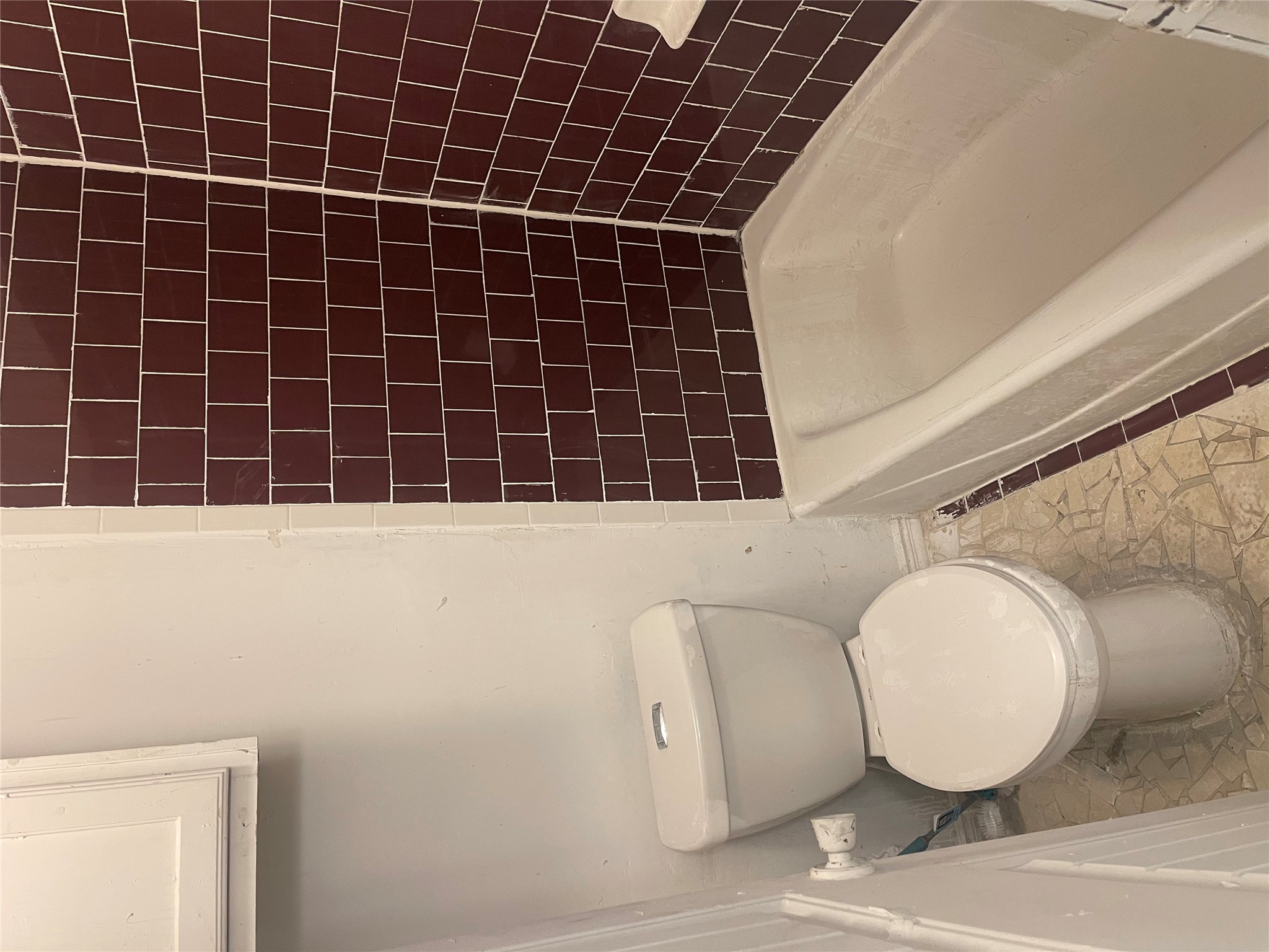 1902 West Loop, Unit A1 Austin, TX 78758 - Photo 10 of 22 a bathroom with a white toilet and a bathtub