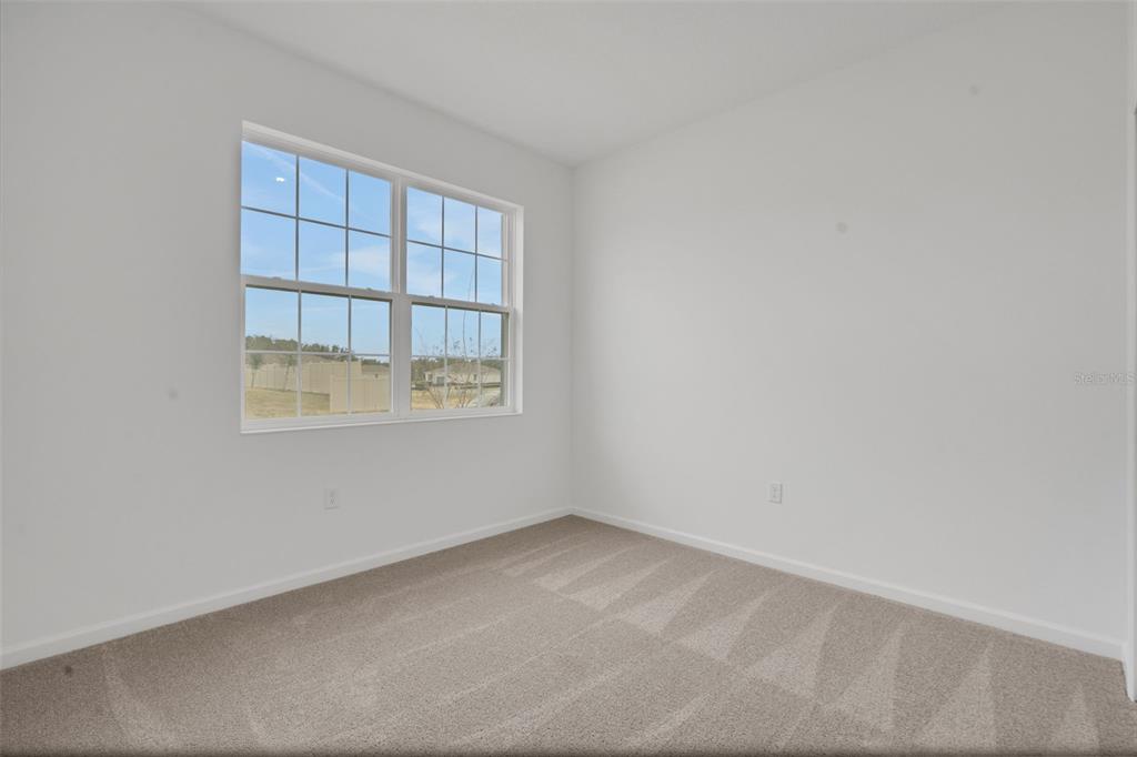 2878 Supermarine Road Tavares, FL 32778 - Photo 12 of 23 an empty room with a window