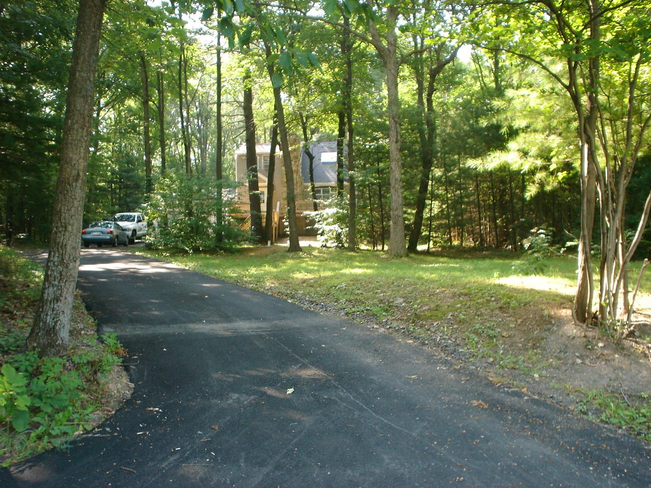 89 Comanche Pines Road Effort, PA 18330 - Photo 3 of 8 a backyard of a house with lots of green space