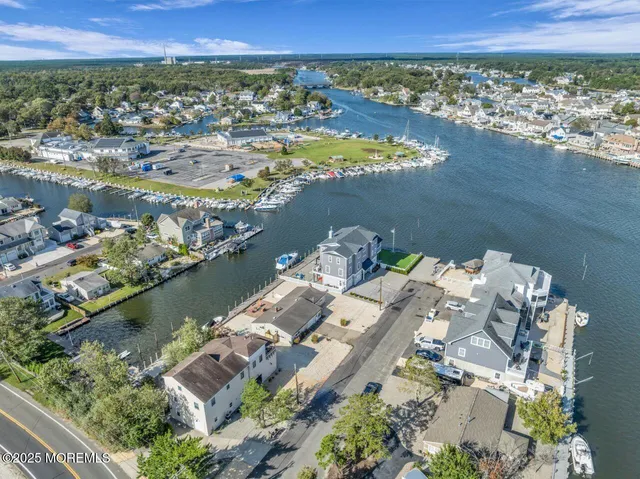 an aerial view of a house with a lake view