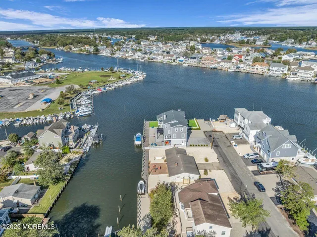 an aerial view of a house with a ocean view
